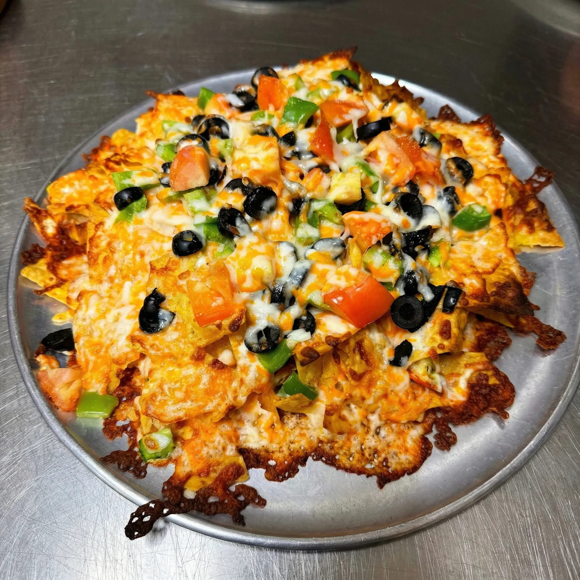 Fresh pizza at Pappa's Family Restaurant & Lounge Edmonton - thick crust with generous toppings